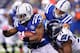 INDIANAPOLIS, IN - OCTOBER 06: Trent Richardson #34 of the Indianapolis Colts runs the ball as Chris Clemons #91 of the Seattle Seahawks wraps him up for a tackle from behind at Lucas Oil Stadium on October 6, 2013 in Indianapolis, Indiana. (Photo by Mich