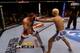 Pierce comes in and Koscheck cups Pierce's cheek while digging his thumb into Pierce's eye.