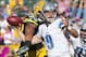 Oct 6, 2013; Green Bay, WI, USA; Green Bay Packers linebacker Nick Perry (53) knocks the football away from Detroit Lions quarterback Matthew Stafford (9) during the fourth quarter at Lambeau Field. The Packers won 22-9. Mandatory Credit: Jeff Hanisch-USA