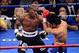 Jun. 9, 2012; Las Vegas, NV, USA; Timothy Bradley Jr (left) punches Manny Pacquiao during the second round of a welterweight championship bout at the MGM Grand Garden Arena. Mandatory Credit: Mark J. Rebilas-USA TODAY Sports