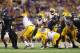 ARLINGTON, TX - AUGUST 31: Alfred Blue #4 of the LSU Tigers runs the ball against the TCU Horned Frogs and Elisha Olabode #6 at AT&T Stadium on August 31, 2013 in Arlington, Texas. (Photo by Ronald Martinez/Getty Images)