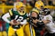 GREEN BAY, WI - DECEMBER 07: Paul Kruger #99 of the Baltimore Ravens grabs the jersey of Aaron Rodgers #12 of the Green Bay Packers as Chad Clifton #76 tries to block at Lambeau Field on December 7, 2009 in Green Bay, Wisconsin. The Packers defeated the R