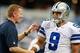 Oct 6, 2013; Arlington, TX, USA; Dallas Cowboys head coach Jason Garrett talks to quarterback Tony Romo (9) before the game against the Denver Broncos at AT&T Stadium. Mandatory Credit: Tim Heitman-USA TODAY Sports