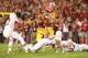 Oct 3, 2013; Ames, IA, USA; Iowa State Cyclones running back Aaron Wimberly (2) runs past the Texas Longhorns safety Mykkele Thompason (2), cornerback Carrington Byndom (23) and safety Adrian Phillips (17) during the fourth quarter at Jack Trice Stadium.
