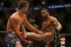 Jun 15, 2013; Winnipeg, MB, Canada; Jake Shields (left) fights Tyron Woodley during their Welterweight bout at UFC 161 at MTS Centre. Mandatory Credit: Tom Szczerbowski-USA TODAY Sports