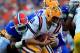 GAINESVILLE, FL - OCTOBER 06: Zach Mettenberger #8 of the LSU Tigers is tackled by Jon Bostic #1 of the Florida Gators during the game at Ben Hill Griffin Stadium on October 6, 2012 in Gainesville, Florida. (Photo by Sam Greenwood/Getty Images)