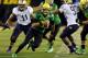 EUGENE, OR - OCTOBER 6: Quarterback Marcus Mariota #8 of the Oregon Ducks scrambles out of the pocket during the first quarter of the game against the Washington Huskies on October 6, 2012 at Autzen Stadium in Eugene, Oregon. Oregon won the game 52-21. (P
