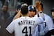 Oct 8, 2013; Detroit, MI, USA; Detroit Tigers outfielder Jhonny Peralta (right) celebrates with designated hitter Victor Martinez (41) after hitting a three-run home run against the Oakland Athletics during the fifth inning in game four of the American Le