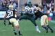 BOULDER, CO - OCTOBER 05: Running back Byron Marshall #9 of the Oregon Ducks rushes with the ball as linebacker Derrick Webb #1 of the Colorado Buffaloes makes the tackle a defensive back Greg Henderson #20 of the Colorado Buffaloes follow the play at Fo