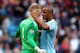 MANCHESTER, ENGLAND - OCTOBER 05: Goalkeeper Joe Hart of Manchester City celebrates with teammate Vincent Kompany of Manchester City after making a save during the Barclays Premier League match between Manchester City and Everton at Etihad Stadium on Oct