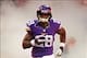 Sep 29, 2013; London, UNITED KINGDOM; Minnesota Vikings running back Adrian Peterson (28) runs onto the field through a cloud of smoke before the game against the Pittsburgh Steelers in the NFL International Series game at Wembley Stadium. Mandatory Credi