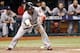 Oct 7, 2013; St. Petersburg, FL, USA; Boston Red Sox right fielder Shane Victorino (18) bunts during the ninth inning against the Tampa Bay Rays in game three of the American League divisional series at Tropicana Field. The Rays won 5-4. Mandatory Credit: