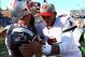 Sep 22, 2013; Foxborough, MA, USA; New England Patriots defensive end Rob Ninkovich (50) and Tampa Bay Buccaneers quarterback Josh Freeman (right) embrace after a game at Gillette Stadium. Mandatory Credit: Mark L. Baer-USA TODAY Sports