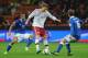 MILAN, ITALY - OCTOBER 16: Nicklas Bendtner (C) of Denmark in action against Pablo Daniel Osvaldo (L) and Daniele De Rossi of Italy during the FIFA 2014 World Cup qualifier match between Italy and Denmark at Stadio Giuseppe Meazza on October 16, 2012 in