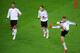 GDANSK, POLAND - JUNE 21: Thomas Muller (R), Sami Khedira (L) and Mesut Ozil of Germany in action during a Germany training session ahead of the UEFA EURO 2012 quarter-final match against Greece at the Municipal Stadium on June 21, 2012 in Gdansk, Poland