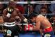 LAS VEGAS, NV - JUNE 09: (L-R) Timothy Bradley lands a left to the head of Manny Pacquiao during their WBO welterweight title fight at MGM Grand Garden Arena on June 9, 2012 in Las Vegas, Nevada. (Photo by Jeff Bottari/Getty Images)