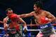 LAS VEGAS, NV - DECEMBER 08: (R-L) Manny Pacquiao throws a right at Juan Manuel Marquez during their welterweight bout at the MGM Grand Garden Arena on December 8, 2012 in Las Vegas, Nevada. (Photo by Al Bello/Getty Images)