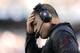 FOXBORO, MA - SEPTEMBER 22: Head coach Greg Schiano holds his head during the fourth quarter of their 23-3 loss to the New England Patriots at Gillette Stadium on September 22, 2013 in Foxboro, Massachusetts. (Photo by Winslow Townson/Getty Images)