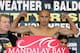 LAS VEGAS - NOVEMBER 03: Boxing promoter Dan Goosen (L) watches as Orlando Salido of Mexico poses during his official weigh-in at the Mandalay Bay Events Center November 3, 2006 in Las Vegas, Nevada. Salido will challenge IBF featherweight champion Rober