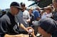 CHICAGO, IL - JUNE 17: Manager Joe Girardi #28 of the New York Yankees signs autographs before a game against the Chicago Cubs at Wrigley Field on June 17, 2011 in Chicago, Illinois. (Photo by Jonathan Daniel/Getty Images)