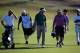 FARO, PORTUGAL - OCTOBER 09: Gonzalo Fernandez-Castano (C) of Spain walks on the first hole with playing partners during the ProAm at the Portugal Masters held at Oceanico Victoria Golf Course on October 9, 2013 in Faro, Portugal. (Photo by Dean Mouhtar