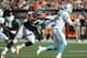 Sep 8, 2013; Cleveland, OH, USA; Cleveland Browns linebacker Jabaal Sheard (97) chases Miami Dolphins quarterback Ryan Tannehill (17) during the third quarter at FirstEnergy Stadium. Mandatory Credit: Ken Blaze-USA TODAY Sports