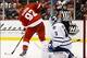 Sep 27, 2013; Detroit, MI, USA; Detroit Red Wings left wing Johan Franzen (93) redirects a shot by defenseman Niklas Kronwall (not pictured) for a goal on Toronto Maple Leafs goalie Jonathan Bernier (45) in the third period at Joe Louis Arena. Detroit won