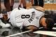 January 11, 2013; Brooklyn, NY, USA; Brooklyn Nets guard Deron Williams (8) falls to the court as he suffers a leg injury against the Phoenix Suns during the third quarter of an NBA game at Barclays Center. Mandatory Credit: Brad Penner-USA TODAY Sports