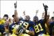 Oct 5, 2013; Ann Arbor, MI, USA; Michigan Wolverines fullback Sione Houma (39) and wide receiver Csont'e York (81) celebrate after the game against the Minnesota Golden Gophers at Michigan Stadium. Michigan won 42-13. Mandatory Credit: Rick Osentoski-USA