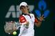 SHANGHAI, CHINA - OCTOBER 09: Kei Nishikori of Japan returns a shot to Jurgen Melzer of Austria during day three of the Shanghai Rolex Masters at the Qi Zhong Tennis Center on October 9, 2013 in Shanghai, China. (Photo by Lintao Zhang/Getty Images)