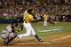 Yoenis Cespedes ignites the crowd at the O.co Coliseum as he sends an offering from Max Scherzer into the left field bleachers in Game 1.