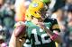 GREEN BAY, WI - OCTOBER 06: Aaron Rodgers #12 of the Green Bay Packers warms up before the game against the Detroit Lions at Lambeau Field on October 6, 2013 in Green Bay, Wisconsin. (Photo by Harry How/Getty Images)