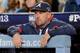 LOS ANGELES, CA - OCTOBER 07: Manager Fredi Gonzalez #33 of the Atlanta Braves watches from the dugout while taking on the Los Angeles Dodgers in Game Four of the National League Division Series at Dodger Stadium on October 7, 2013 in Los Angeles, Califo
