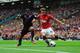 MANCHESTER, ENGLAND - SEPTEMBER 14: Adnan Januzaj of Manchester United takes on Jason Puncheon of Crystal Palace during the Barclays Premier League match between Manchester United and Crystal Palace at Old Trafford on September 14, 2013 in Manchester, En