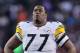 DENVER, CO - JANUARY 08: Marcus Gilbert #77 of the Pittsburgh Steelers looks on against the Denver Broncos during the Wild Card Playoffs at Sports Authority Field at Mile High on January 8, 2012 in Denver, Colorado. (Photo by Jeff Gross/Getty Images)