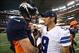 Oct 6, 2013; Arlington, TX, USA; Denver Broncos quarterback Peyton Manning (18) meets with Dallas Cowboys quarterback Tony Romo (9) at the end of the game at AT&T Stadium. The Denver Broncos beat the Dallas Cowboys 51-48. Mandatory Credit: Matthew Emmons