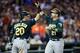 Oct 8, 2013; Detroit, MI, USA; Oakland Athletics catcher Stephen Vogt (21) is congratulated by teammate Josh Donaldson (20) after scoring a run against the Detroit Tigers in the seventh inning in game four of the American League divisional series playoff