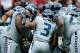 HOUSTON, TX - SEPTEMBER 29: Russell Wilson #3 of the Seattle Seahawks calls a play in the huddle against the Houston Texans at Reliant Stadium on September 29, 2013 in Houston, Texas. (Photo by Scott Halleran/Getty Images)