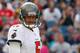 FOXBORO, MA - SEPTEMBER 22: Josh Freeman #5 of the Tampa Bay Buccaneers reacts after an incomplete pass in the second half against the Tampa Bay Buccaneers at Gillette Stadium on September 22, 2013 in Foxboro, Massachusetts. (Photo by Jim Rogash/Getty Im
