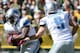 GREEN BAY, WI - OCTOBER 06: Joique Bell #35 of the Detroit Lions takes a handoff from Matthew Stafford #9 during the game against the Green Bay Packers at Lambeau Field on October 6, 2013 in Green Bay, Wisconsin. (Photo by Harry How/Getty Images)