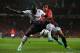 MANCHESTER, ENGLAND - SEPTEMBER 25: Rafael of Manchester United competes with Mamadou Sakho of Liverpool during the Capital One Cup Third Round match betwen Manchester United and Liverpool at Old Trafford on September 25, 2013 in Manchester, England. (P