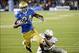 Aug 31, 2013; Pasadena, CA, USA; UCLA Bruins running back Paul Perkins (24) is tackled by Nevada Wolf Pack defensive back Markus Smith (7) during the game at Rose Bowl. Mandatory Credit: Richard Mackson-USA TODAY Sports