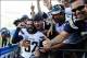 Sep 29, 2013; San Diego, CA, USA; San Diego Chargers safety Eric Weddle (32) celebrates with fans following a win against the Dallas Cowboys at Qualcomm Stadium. The Chargers won 30-21. Mandatory Credit: Christopher Hanewinckel-USA TODAY Sports