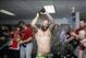 Oct 8, 2013; St. Petersburg, FL, USA; Boston Red Sox first baseman Mike Napoli (center) and teammates celebrate as they pour champagne on them as they beat the Tampa Bay Rays of game four of the American League divisional series at Tropicana Field. Boston