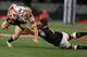 DURBAN, SOUTH AFRICA - AUGUST 16: Brynard Stander of the Sharks looking to tackle Guy Cronje of the Lions during the Absa Currie Cup match between The Sharks and MTN Golden Lions at Growthpoint Kings Park on August 16, 2013 in Durban, South Africa. (Phot