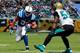 JACKSONVILLE, FL - SEPTEMBER 29: Geno Hayes #55 of the Jacksonville Jaguars attempts to tacklw Donald Brown #31 of the Indianapolis Colts during the game at EverBank Field on September 29, 2013 in Jacksonville, Florida. (Photo by Sam Greenwood/Getty Im
