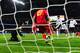 LONDON, ENGLAND - OCTOBER 11: Wayne Rooney of England scores the first goal past Vukasin Poleksic of Montenegro during the FIFA 2014 World Cup Qualifying Group H match between England and Montenegro at Wembley Stadium on October 11, 2013 in London, Engla