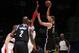 WASHINGTON, DC - OCTOBER 8: Brook Lopez #11 of the Brooklyn Nets shoots against Nene #42 of the Washington Wizards during the pre-season game at the Verizon Center on October 8, 2013 in Washington, DC. NOTE TO USER: User expressly acknowledges and agrees