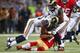 ST. LOUIS, MO - SEPTEMBER 26: Colin Kaepernick #7 of the San Francisco 49ers is tackled by T.J. McDonald #25 and Eugene Sims #97 both of the St. Louis Rams at the Edward Jones Dome on September 26, 2013 in St. Louis, Missouri. The 49ers beat the rams 35-