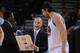 March 25, 2013; Oakland, CA, USA; Golden State Warriors assistant coach Michael Malone (left) instructs center Andrew Bogut (12) during the fourth quarter against the Los Angeles Lakers at Oracle Arena. The Warriors defeated the Lakers 109-103. Mandatory